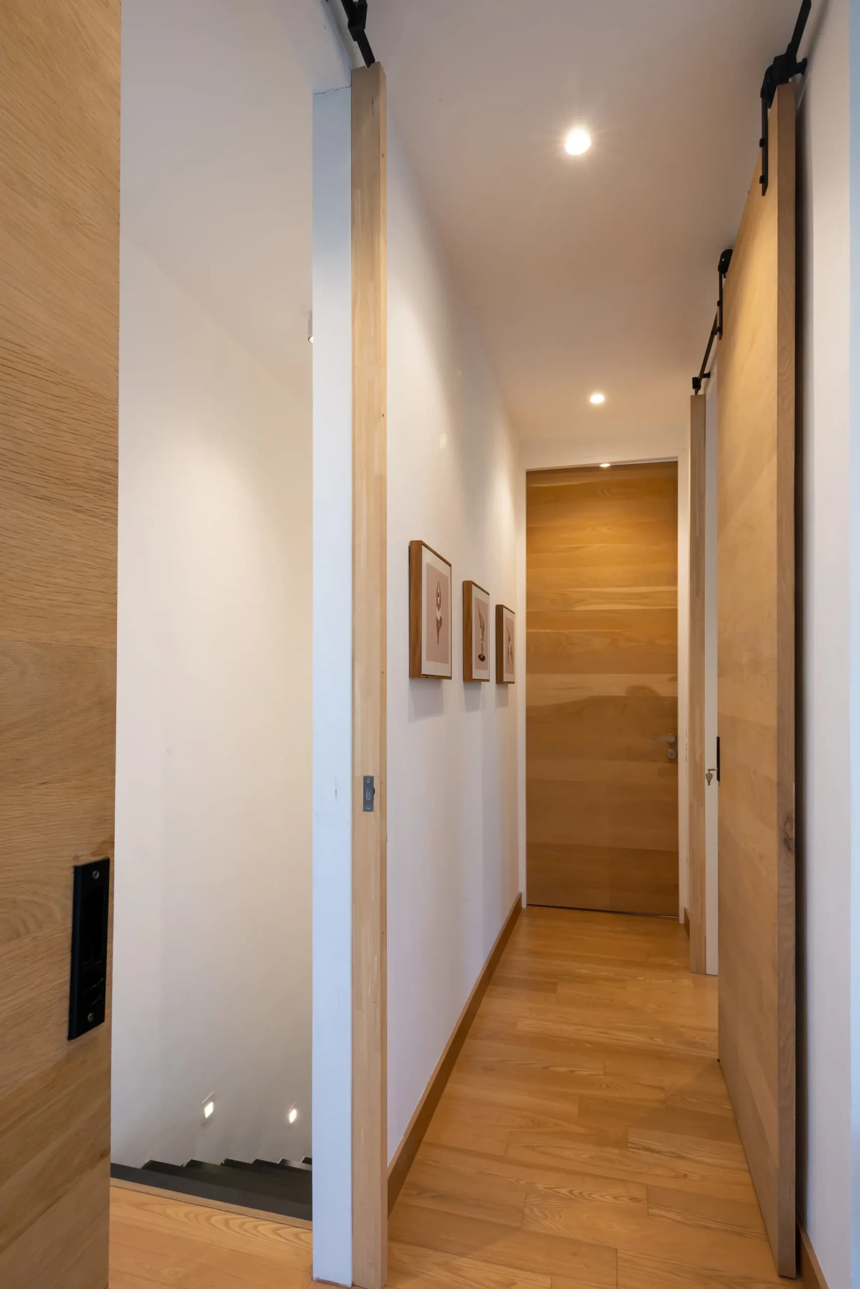 Light oak hallway with sliding wood doors